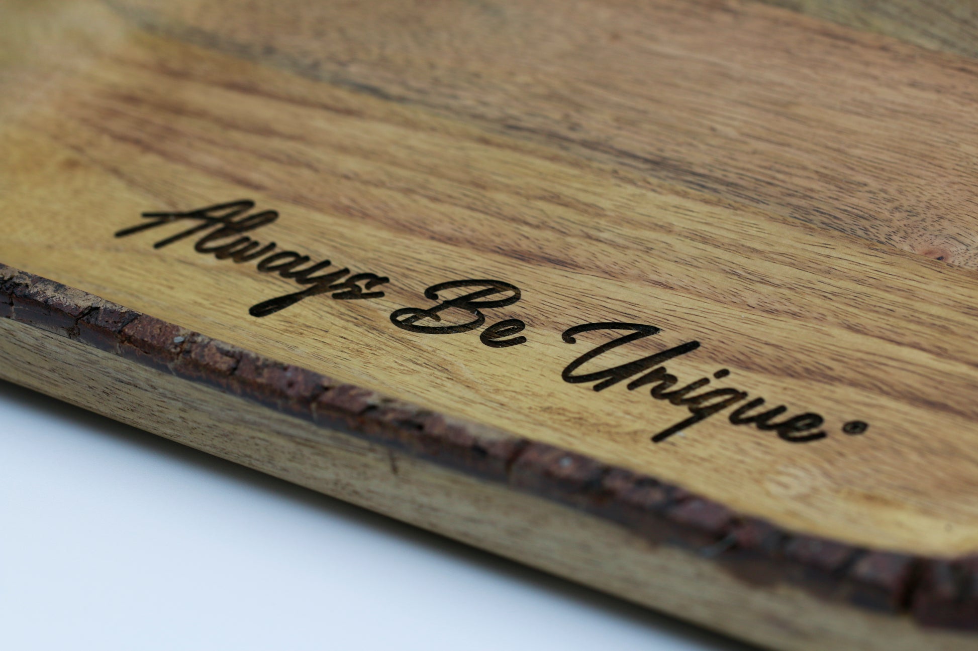 Wooden cutting board with 'Always Be Unique' engraved - this Rustic mango wood serving tray with handles supports individuals with unique abilities. A meaningful gift that gives back.